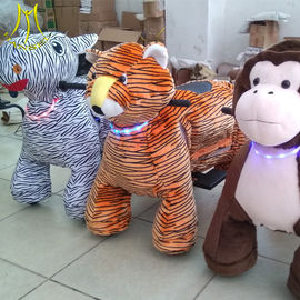 Hansel Guangzhou plush moving toy animal toy horse on 4 wheels for kids proveedor